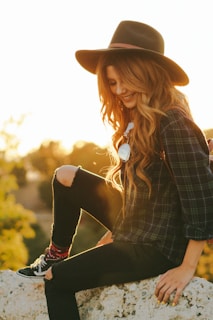 woman waering black blouse and hat