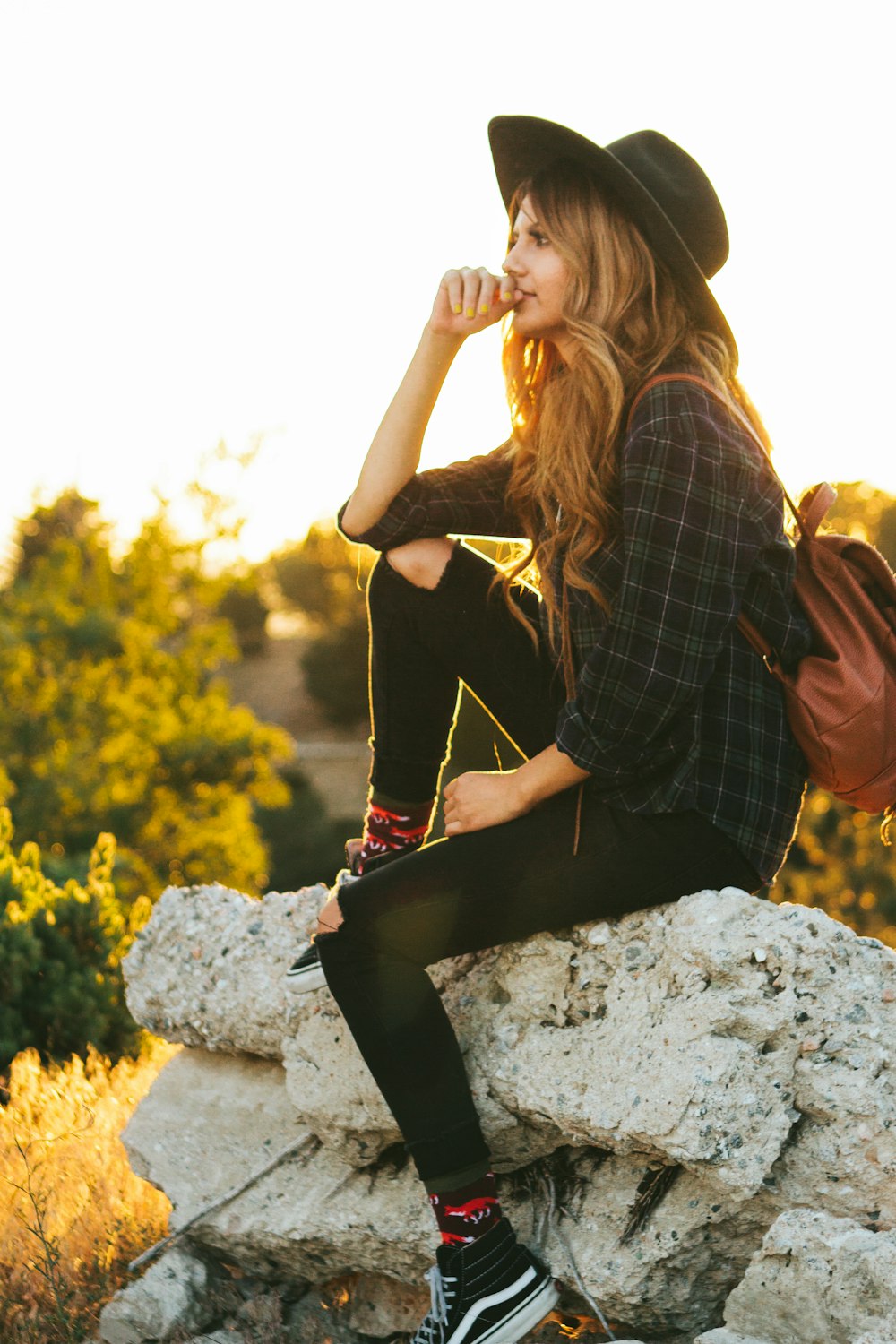 woman wearing black hat