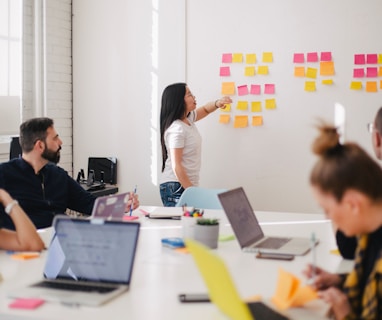 woman placing sticky notes on wall