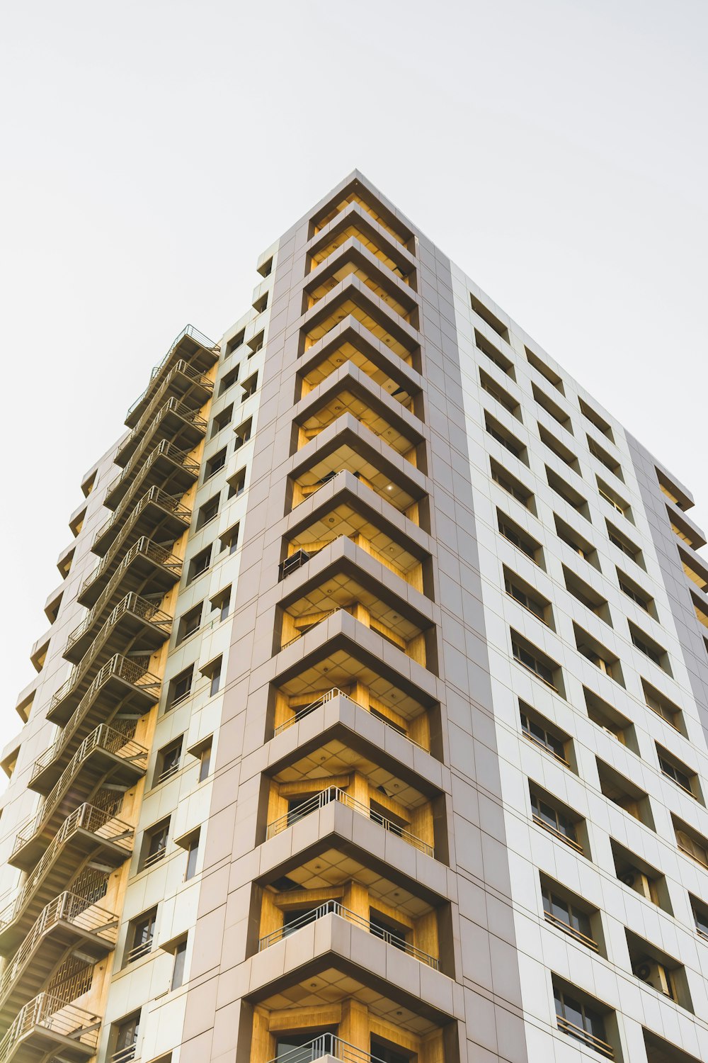 low-angle photography of high-rise building at daytime