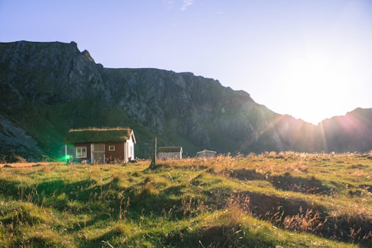 brown house near rocky mountain in Andøya Norway