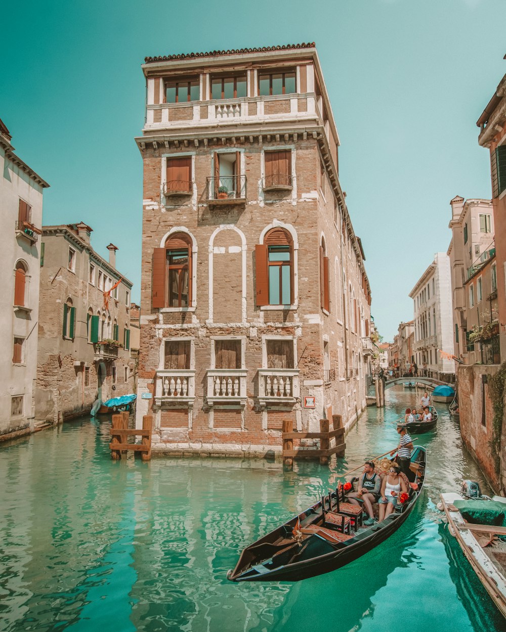 brown boat on water near buildings