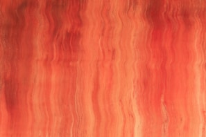 a painting of a red and orange background