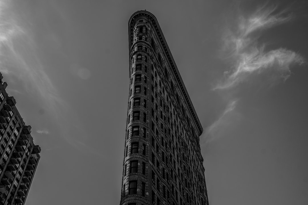 low-angle grayscale photography of Flat Iron building