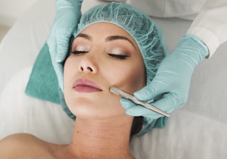 woman doing liposuction on her face