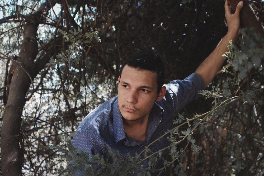 man wearing gray collared shirt