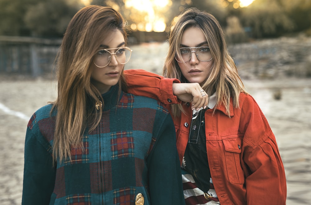 two woman wearing eyeglasses