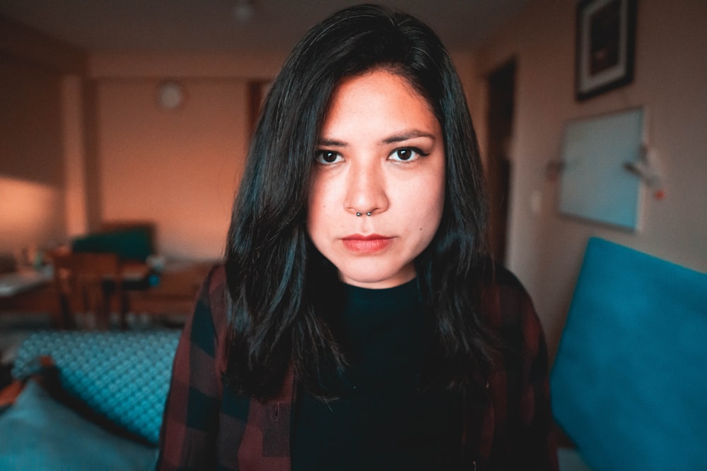 woman in red and black top inside room