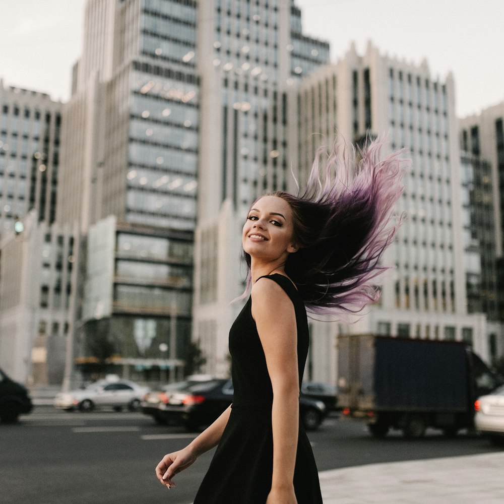 shallow focus photo of woman in black sleeveless dress