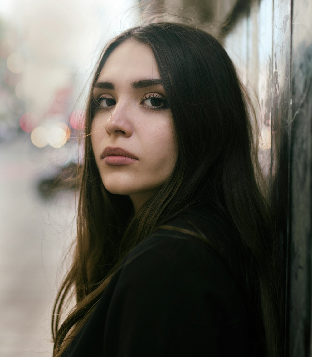 girl wearing black top selective focus photography