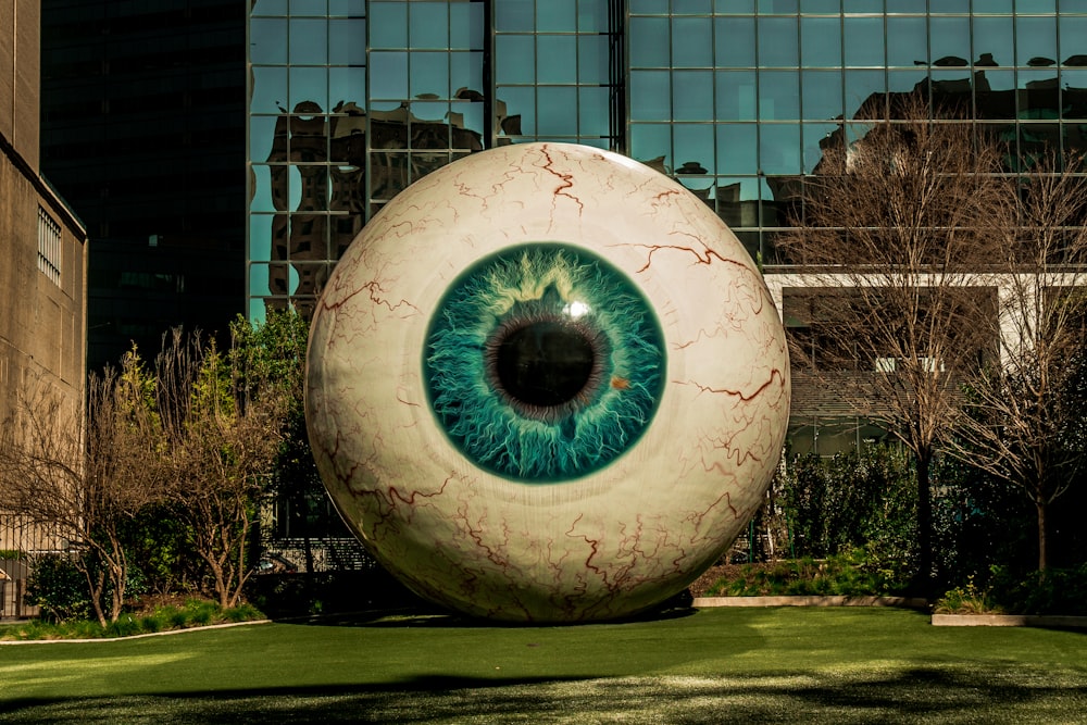 eyeball statue near building