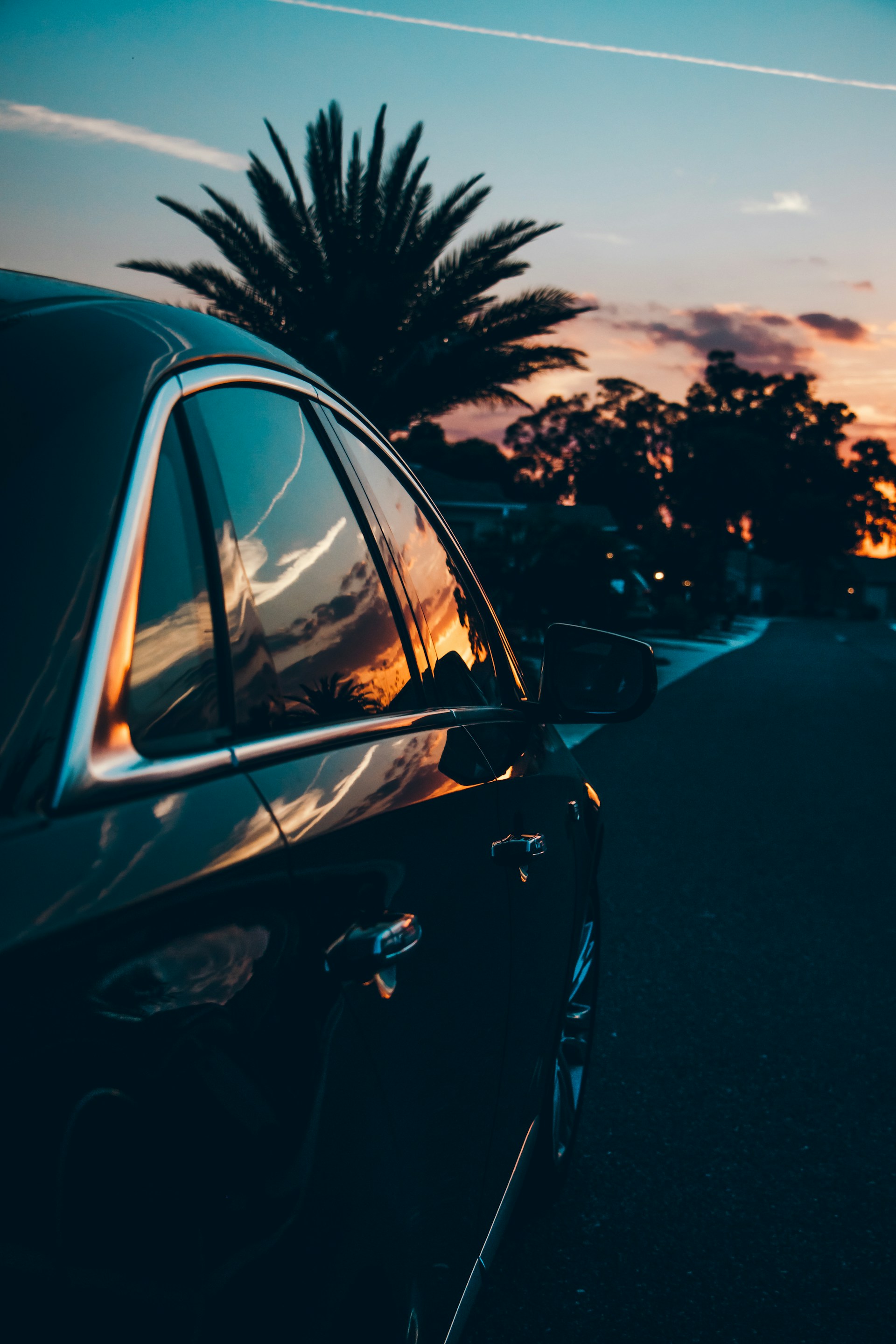 black sedan on road during golden hour