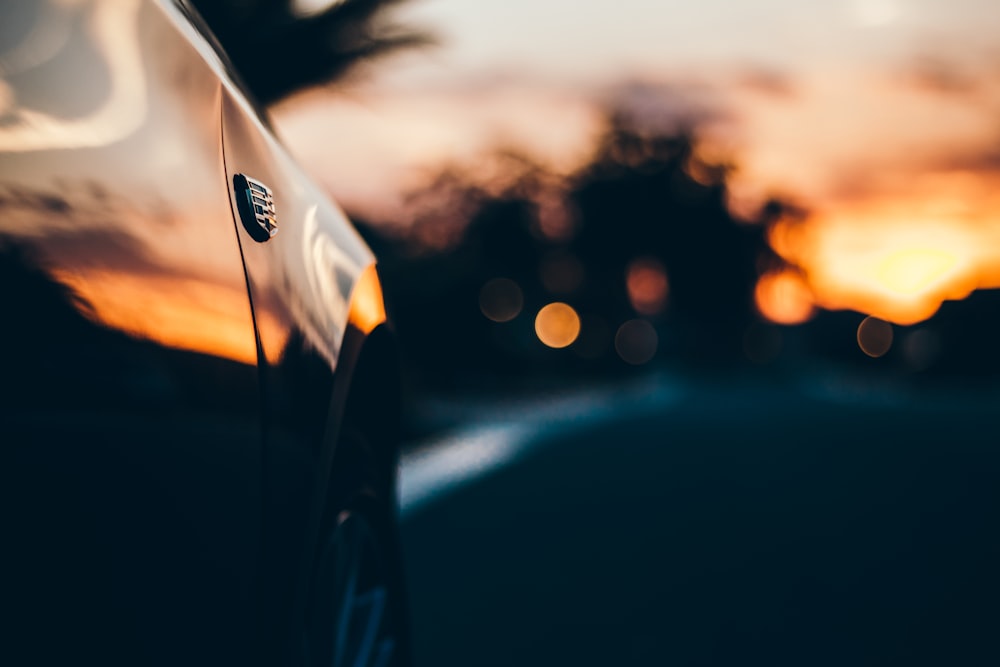 selective focus photography of vehicle side fender