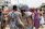 Image of a man carrying a vibrant cotton handblock print bag while walking in a market.