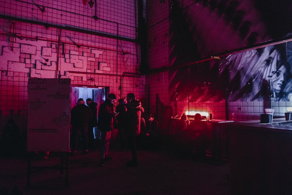 people inside building with red light