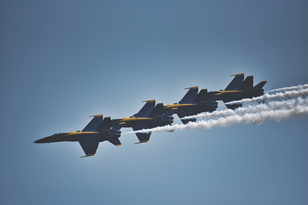 four brown jet fighters