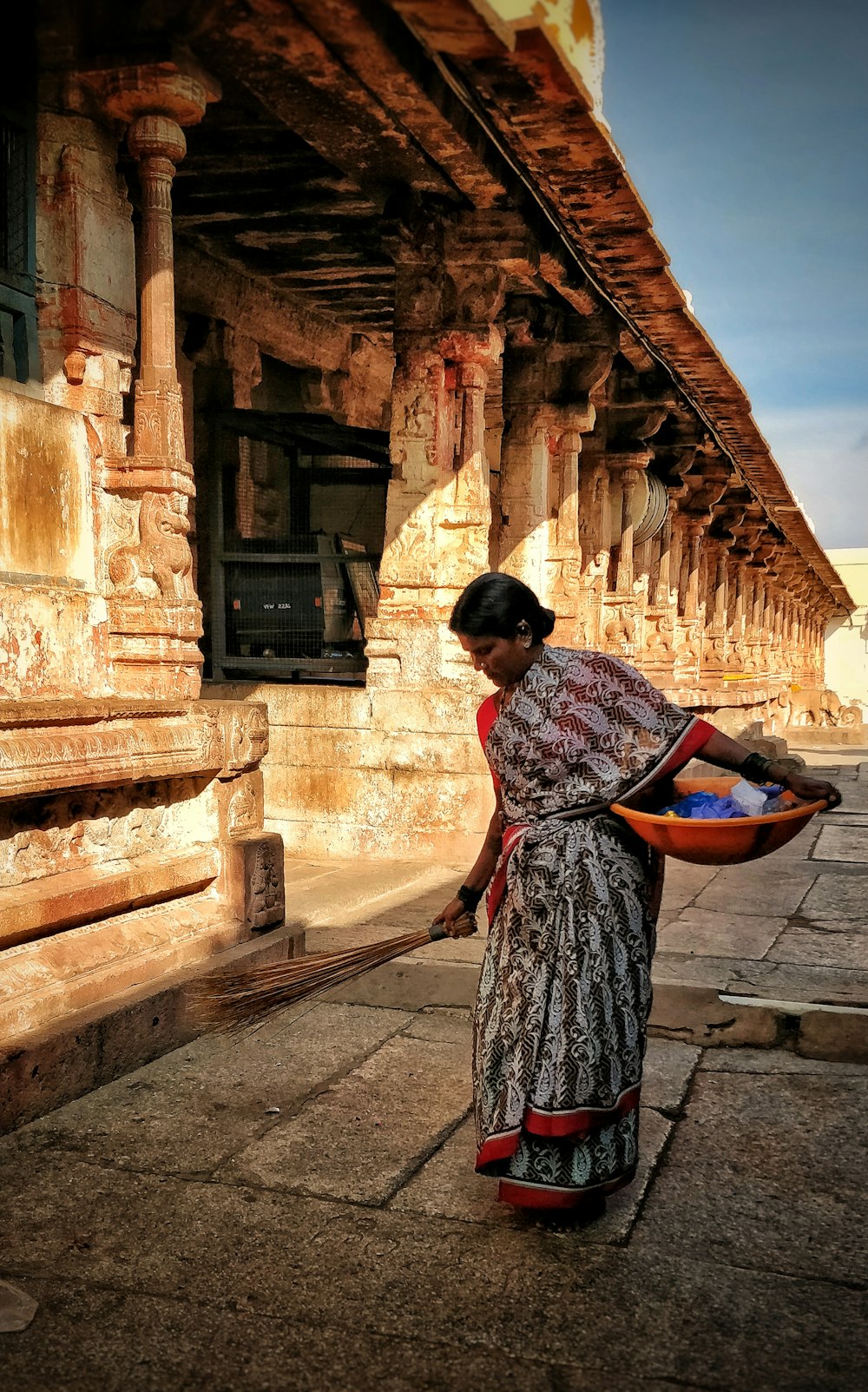 woman standing on pavement during daytime