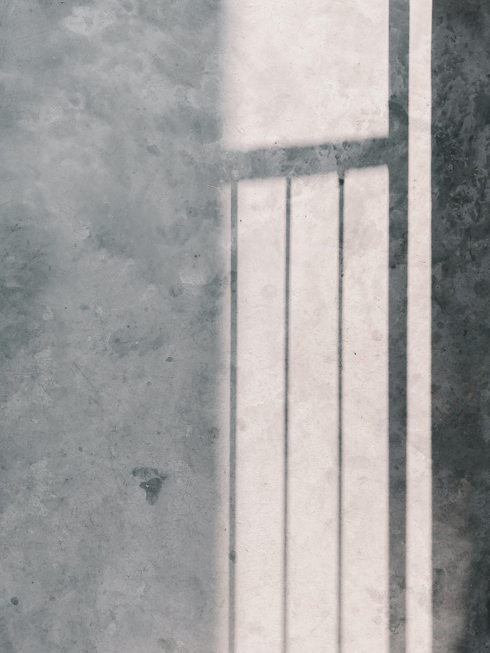 a black and white photo of a jail cell