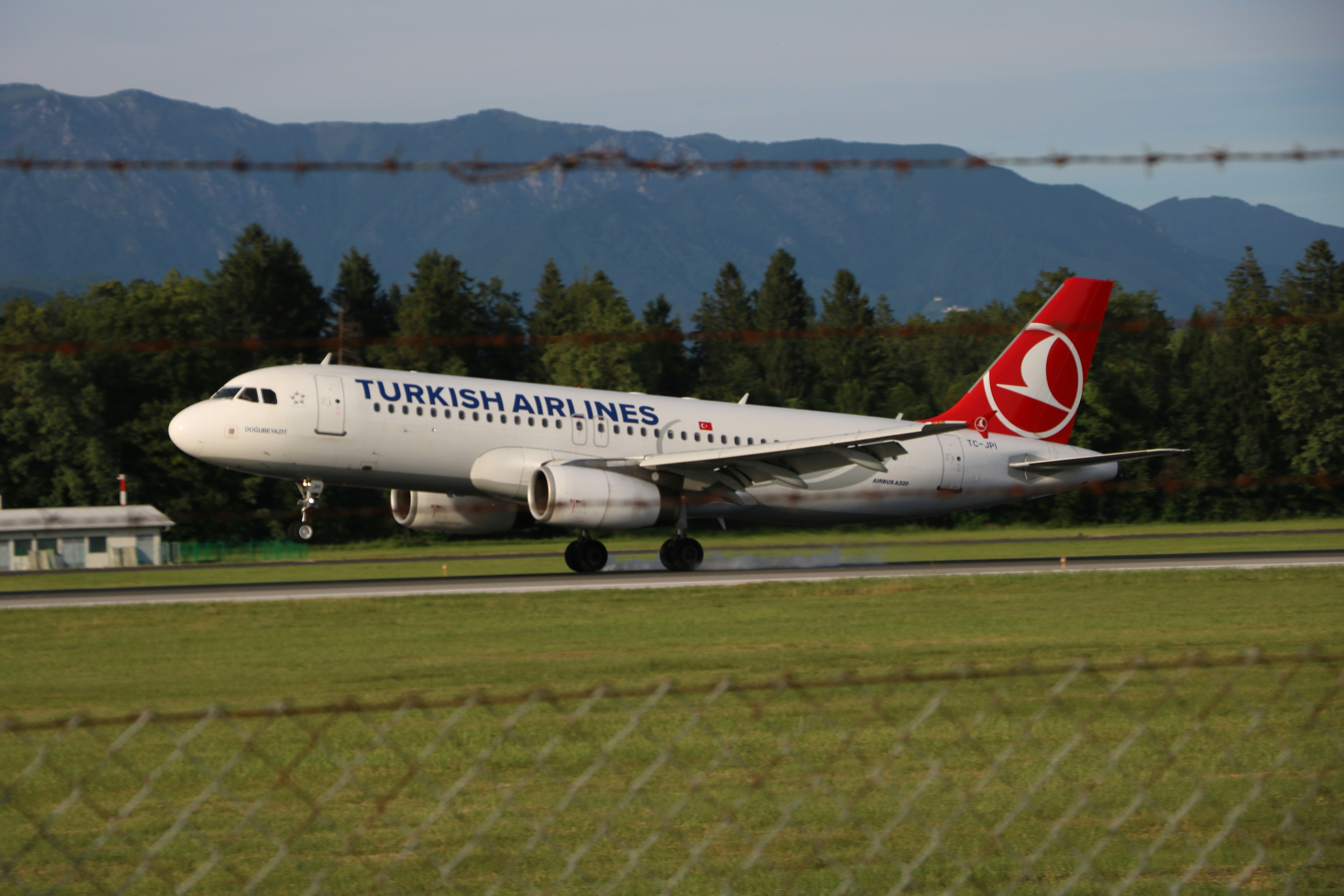 white Turkish Airlines plane, 9 degrees celzium in Ljubljana