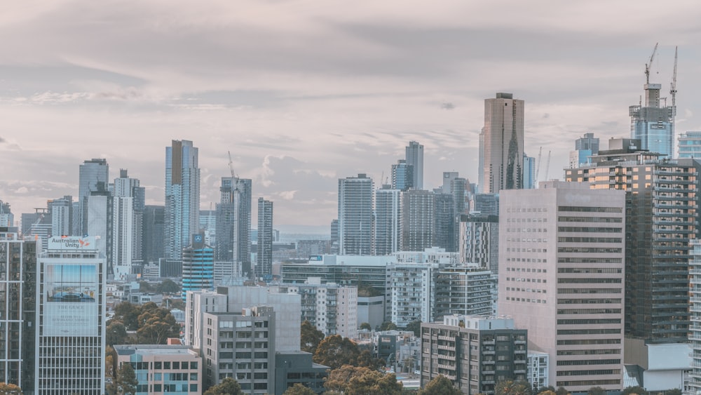 aerial photography of city scape under cloudy sky during daytime