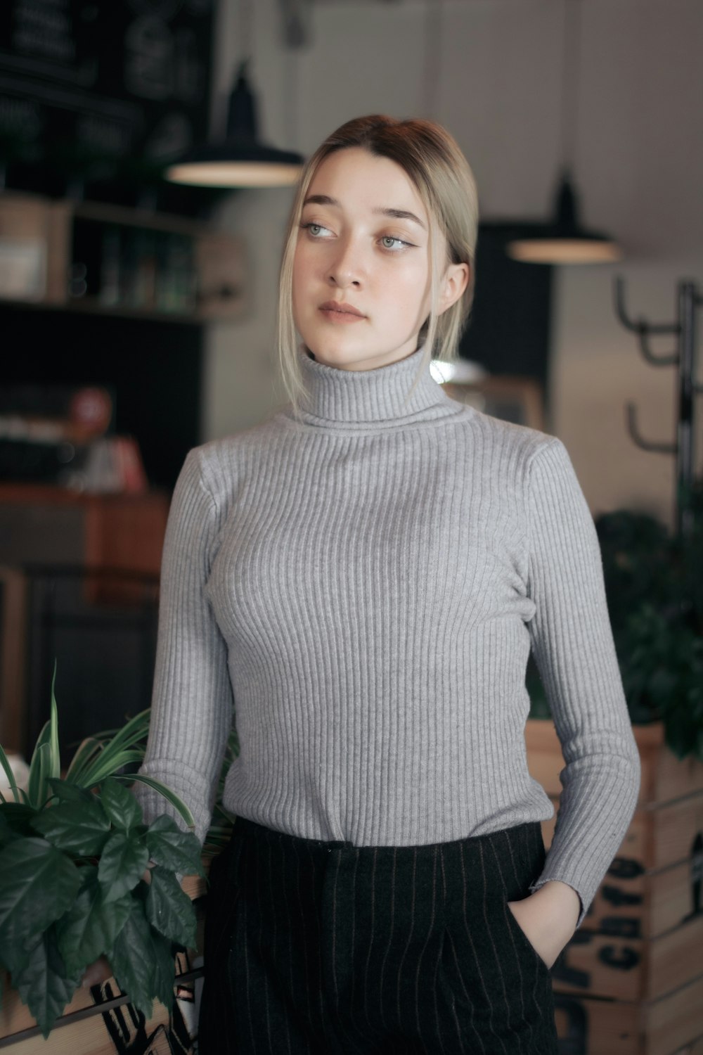 woman wearing gray turtle-neck sweater