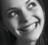 A patient looking confident and joyful after a teeth whitening session.