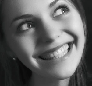 A close-up of a custom portrait painting capturing a joyful expression.