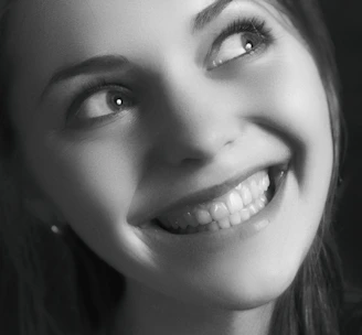 A close-up of a custom portrait painting capturing a joyful expression.