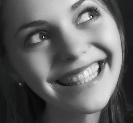 A patient looking confident and joyful after a teeth whitening session.