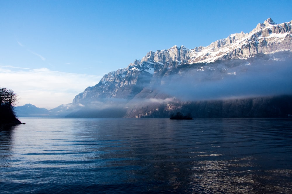 cliff beside body of water