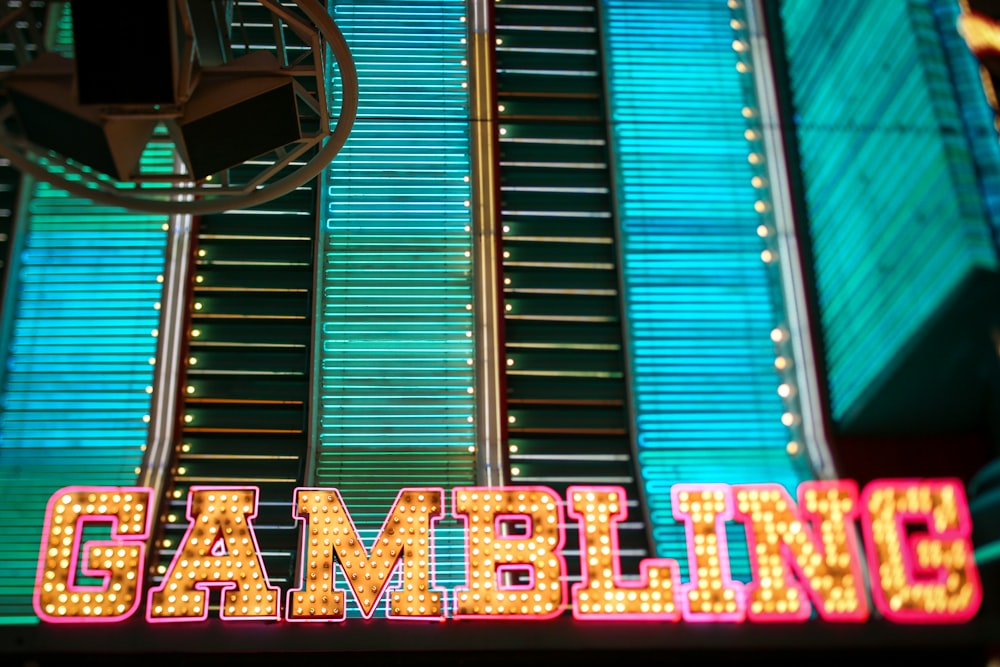 yellow and pink Gambling lighted signage