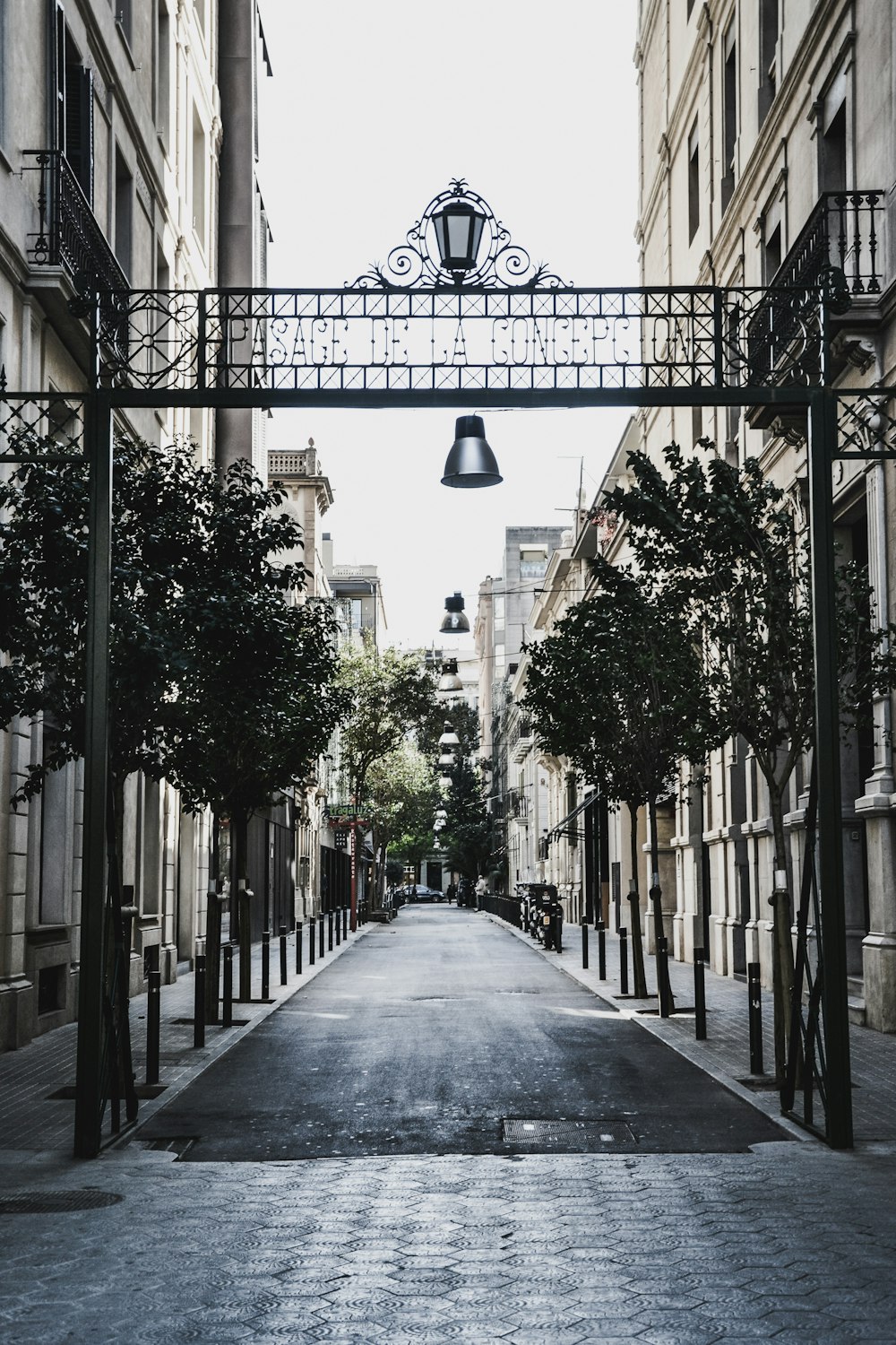 grayscale photo of concrete walkway