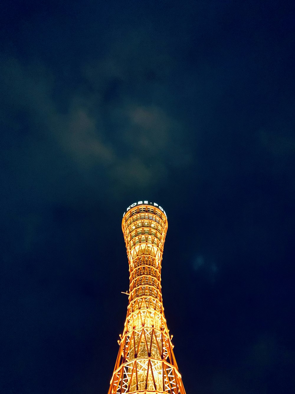 low-angle photography of lighted tower