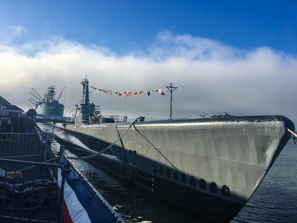 gray ship beside dock