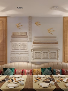 A warm, inviting dining area of Garib Nawaj Hotel with traditional Indian decor and a table set with colorful Indian dishes.