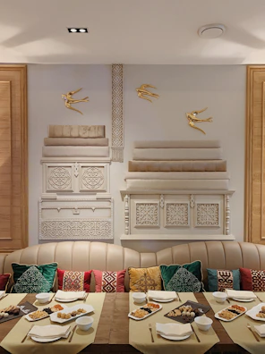 Dining area featuring a wooden table with bohemian textiles and handcrafted decor.