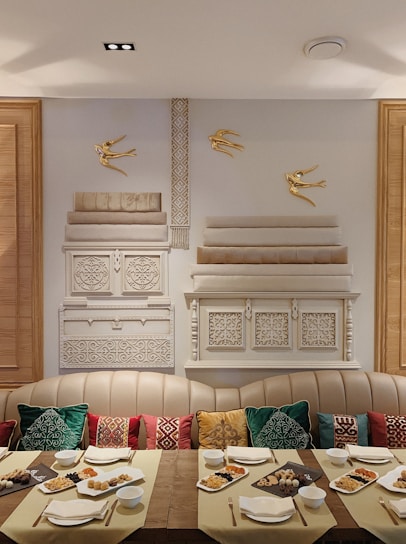 A warm, inviting dining area of Garib Nawaj Hotel with traditional Indian decor and a table set with colorful Indian dishes.