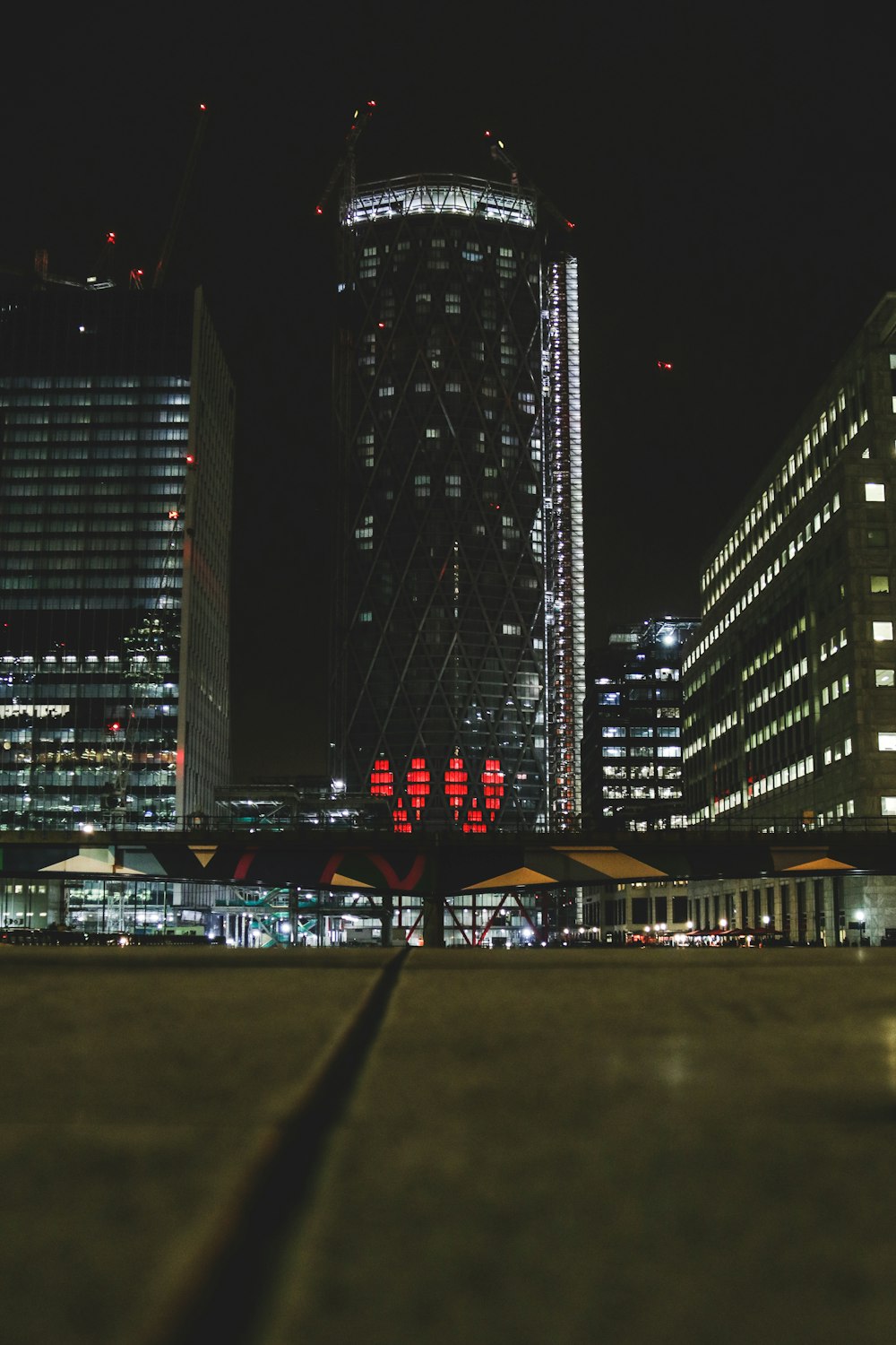 photography of high-rise tower during night time