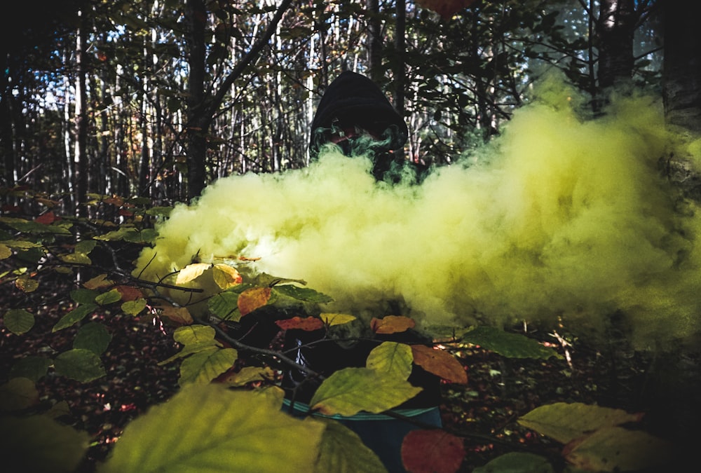 person covered with yellow smoke