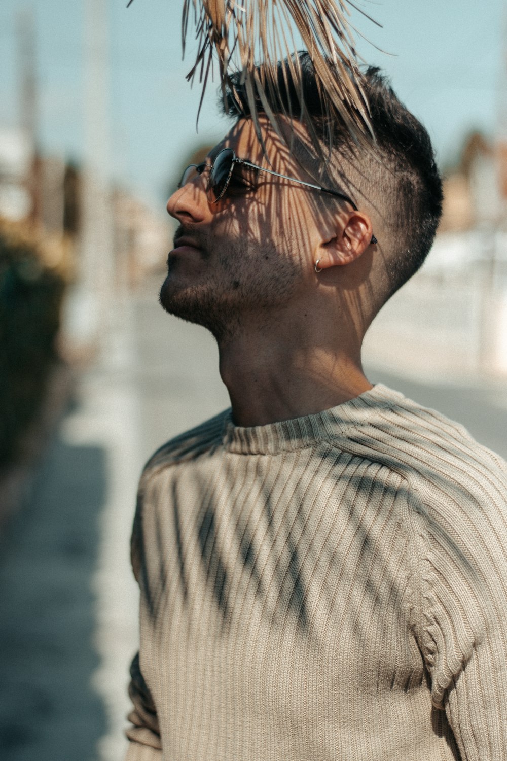 Man wearing sunglasses under leaves photo – Free Boy Image on Unsplash