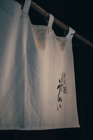 A minimalist design inspired by Japanese calligraphy on a soft cotton fabric.