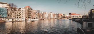 A scenic view of Amsterdam's canals and historic buildings in Noord-Holland.