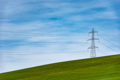 electrical tower on grass field