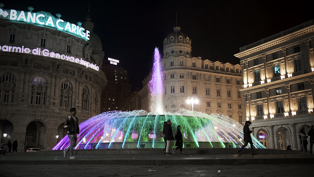 person standing near outdoor fountain