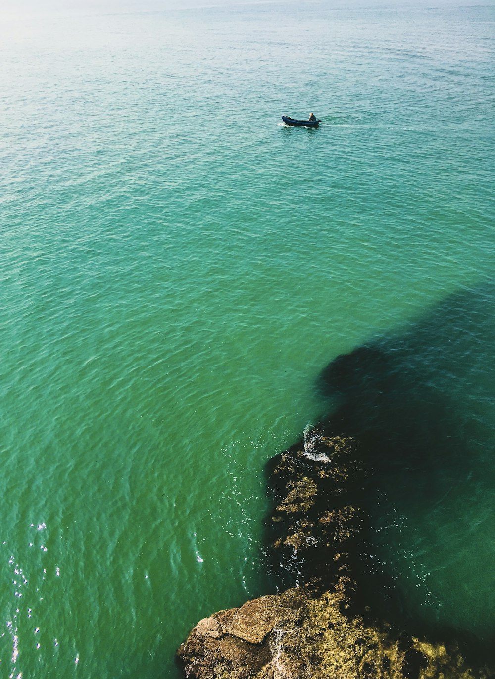 clear blue sea beside cliff