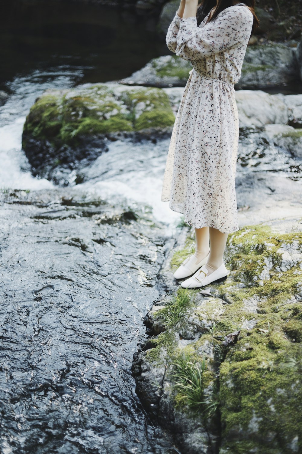 woman wearing white floral dress