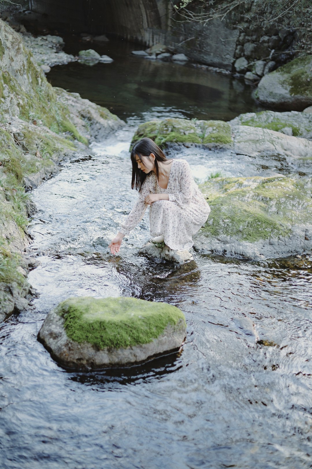 woman standing on rock