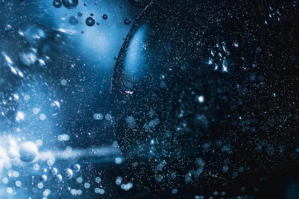 a close up of water droplets on a glass