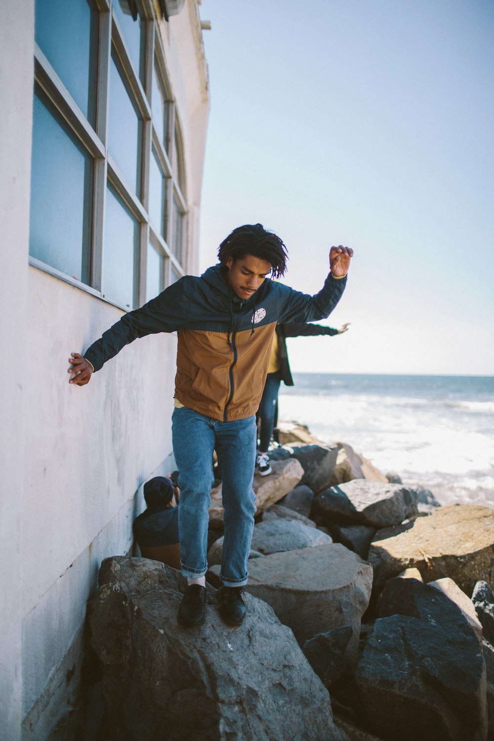 man standing on rock