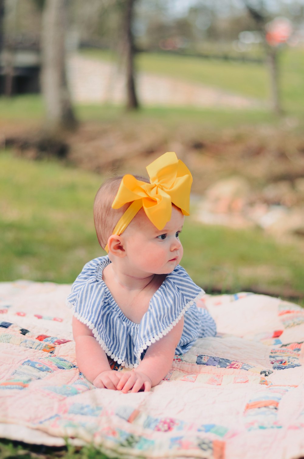 baby on mat in park during daytime